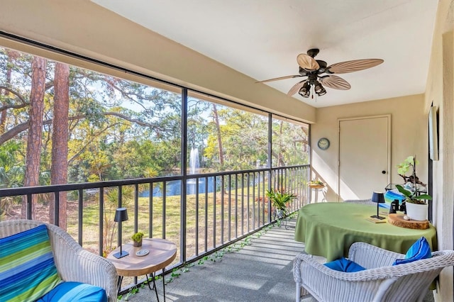 sunroom with a ceiling fan