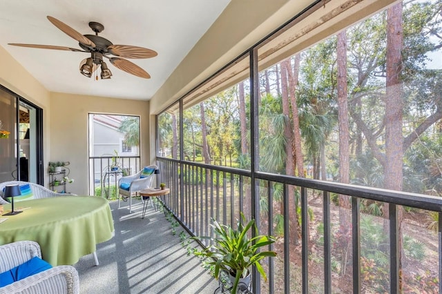 sunroom / solarium with ceiling fan