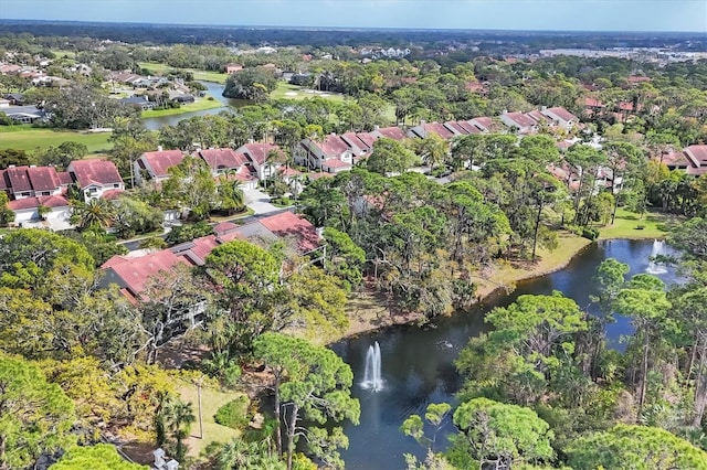 drone / aerial view featuring a water view and a residential view