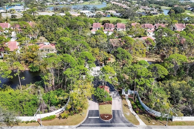 aerial view featuring a water view and a residential view