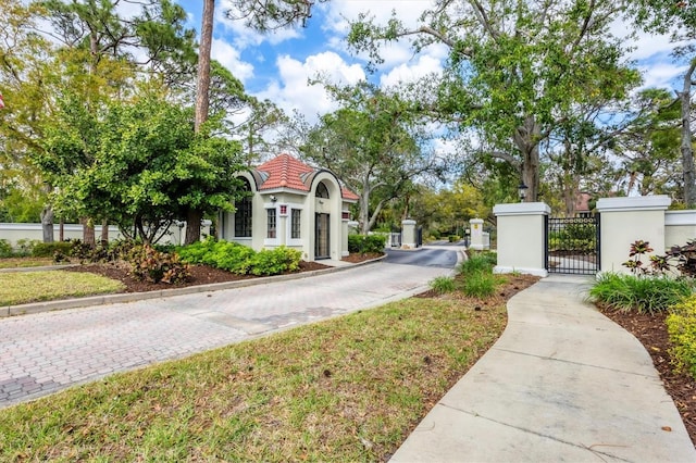 view of road featuring a gate and a gated entry