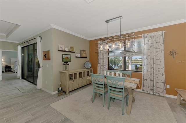 dining room featuring baseboards and ornamental molding