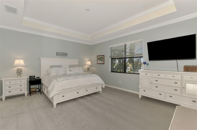 bedroom featuring ornamental molding, a raised ceiling, light colored carpet, and visible vents