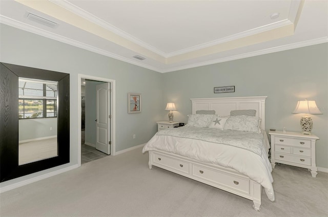 bedroom featuring light carpet, visible vents, and baseboards