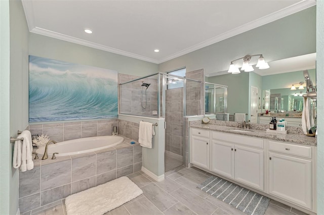 full bath with a stall shower, a garden tub, vanity, and crown molding