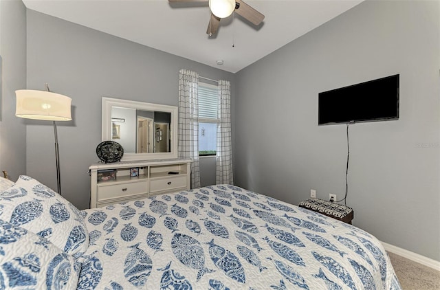 bedroom featuring lofted ceiling, ceiling fan, carpet floors, and baseboards