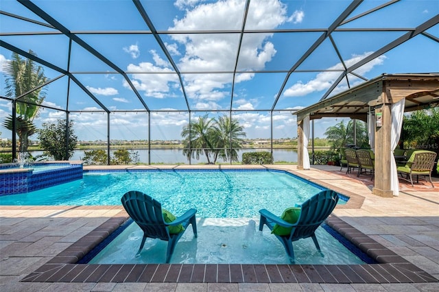 view of swimming pool featuring a pool with connected hot tub, a water view, a gazebo, glass enclosure, and a patio area