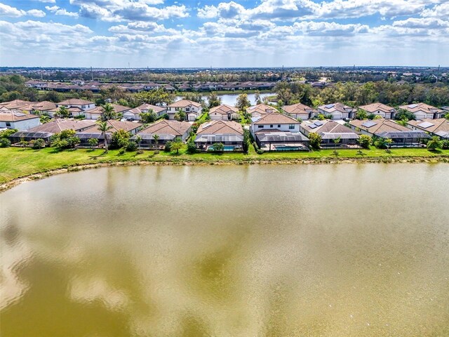 bird's eye view with a water view and a residential view