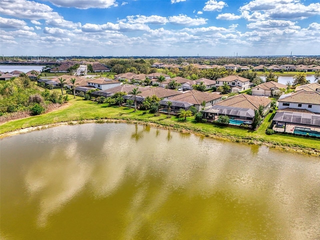 bird's eye view with a water view and a residential view