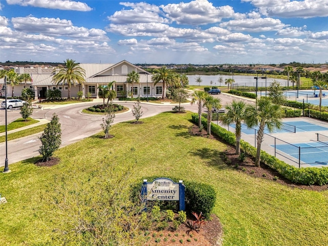 birds eye view of property with a water view