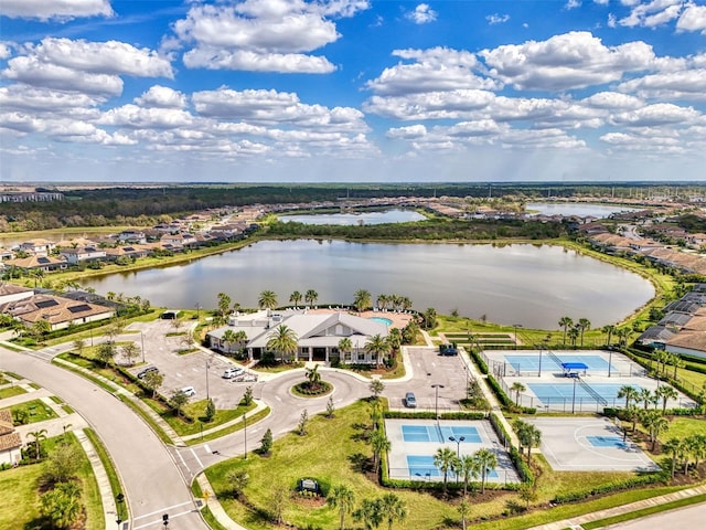 birds eye view of property with a residential view and a water view