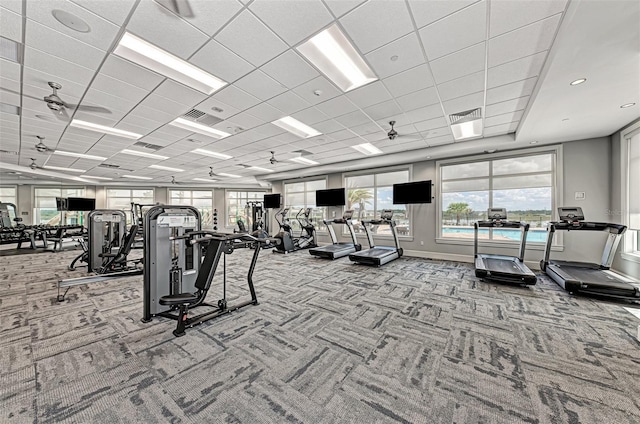 gym featuring a paneled ceiling, carpet, and visible vents