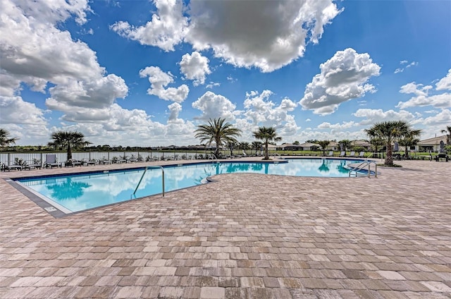 pool featuring a patio and fence