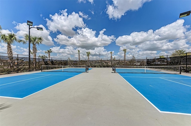 view of sport court with fence