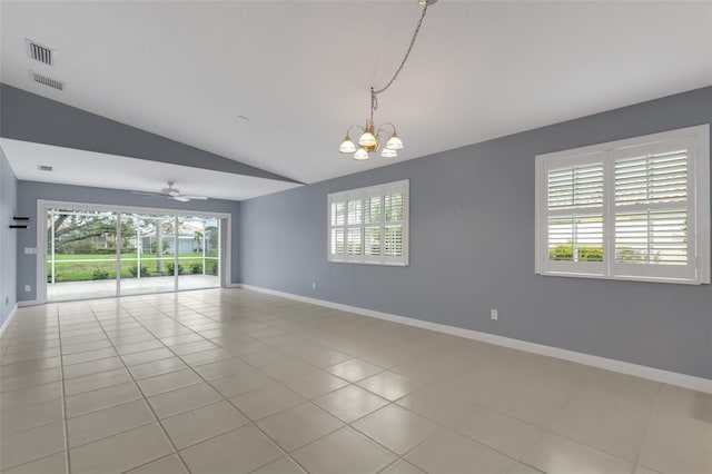 spare room featuring light tile patterned floors, vaulted ceiling, visible vents, and baseboards