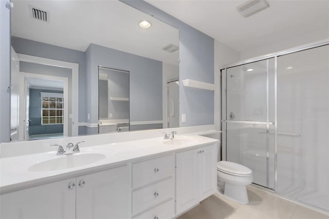 full bath with toilet, a stall shower, a sink, and visible vents