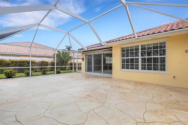 view of patio featuring a lanai