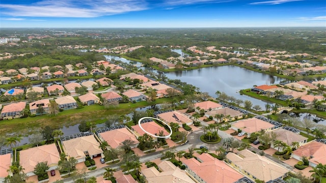 birds eye view of property featuring a water view and a residential view