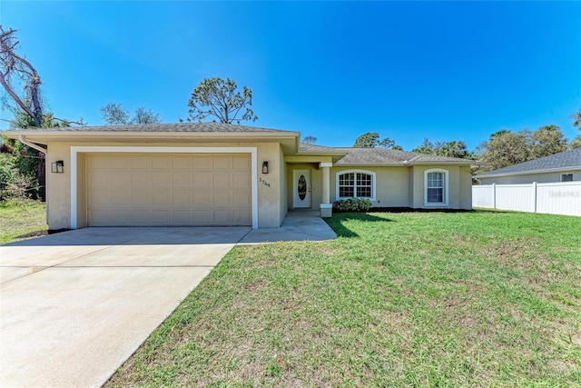 ranch-style home featuring an attached garage, a front yard, fence, and stucco siding