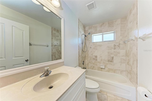 full bath with visible vents, toilet, washtub / shower combination, vanity, and tile patterned flooring