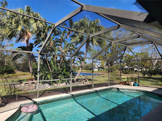 outdoor pool featuring a lanai and a patio