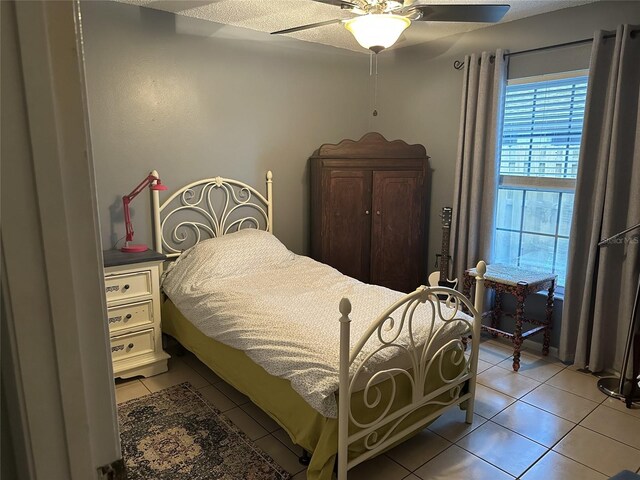 1805 Springwood Dr, Sarasota, FL 34232 - bedroom with light tile patterned floors and ceiling fan