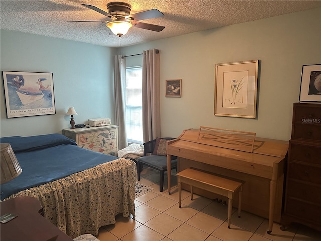 1805 Springwood Dr, Sarasota, FL 34232 - bedroom with a textured ceiling, light tile patterned flooring, and ceiling fan