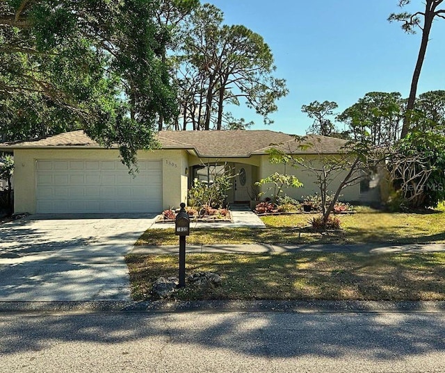 1805 Springwood Dr, Sarasota, FL 34232 - ranch-style house with concrete driveway, an attached garage, and stucco siding