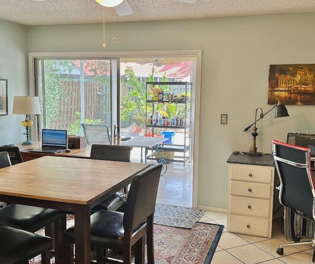 1805 Springwood Dr, Sarasota, FL 34232 - dining area with healthy amount of natural light, light tile patterned floors, an office area, a textured ceiling, and a ceiling fan