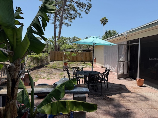 1805 Springwood Dr, Sarasota, FL 34232 - view of patio / terrace featuring a fenced backyard and outdoor dining space