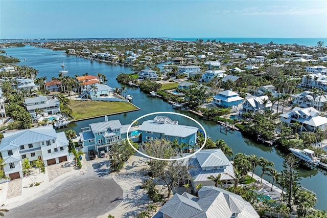 aerial view featuring a water view and a residential view