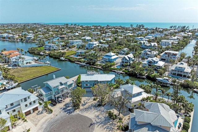 aerial view with a water view and a residential view