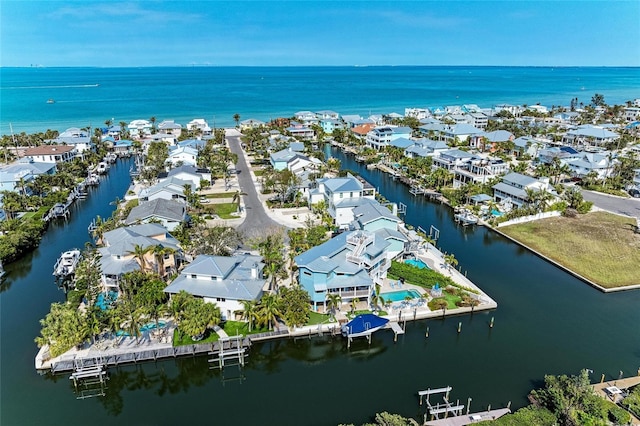 birds eye view of property with a residential view and a water view