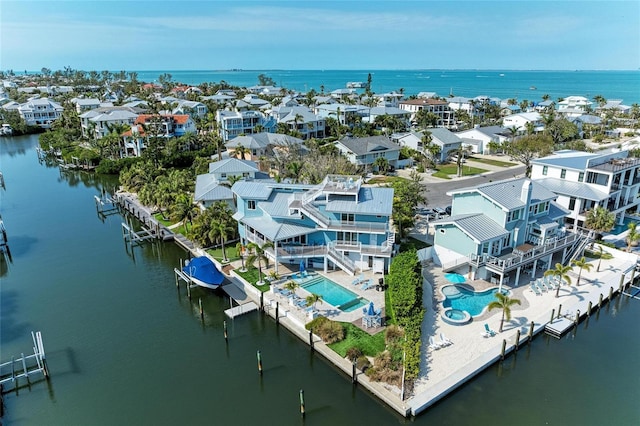 aerial view featuring a residential view and a water view