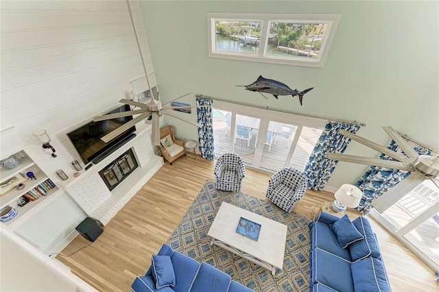 living area featuring a high ceiling and wood finished floors