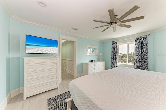 bedroom featuring visible vents, ornamental molding, a ceiling fan, light wood-type flooring, and baseboards