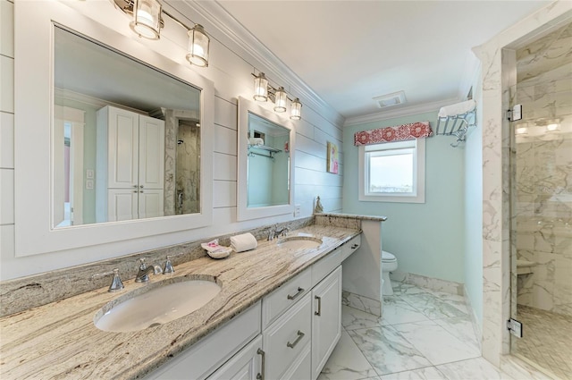 full bathroom featuring marble finish floor, a marble finish shower, ornamental molding, and a sink