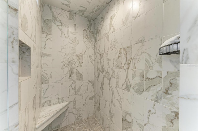 bathroom featuring a tile shower