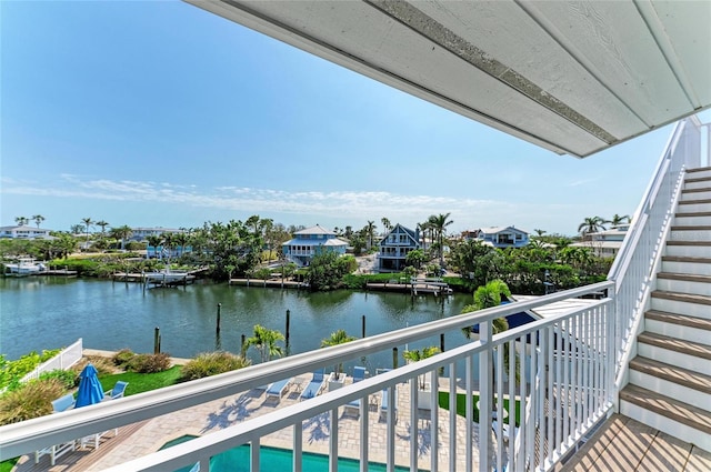 balcony featuring a water view