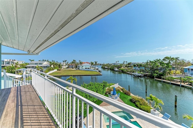 balcony featuring a water view