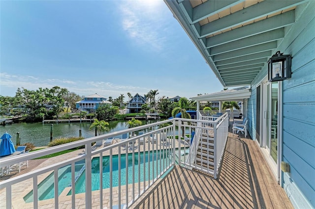 balcony featuring a water view