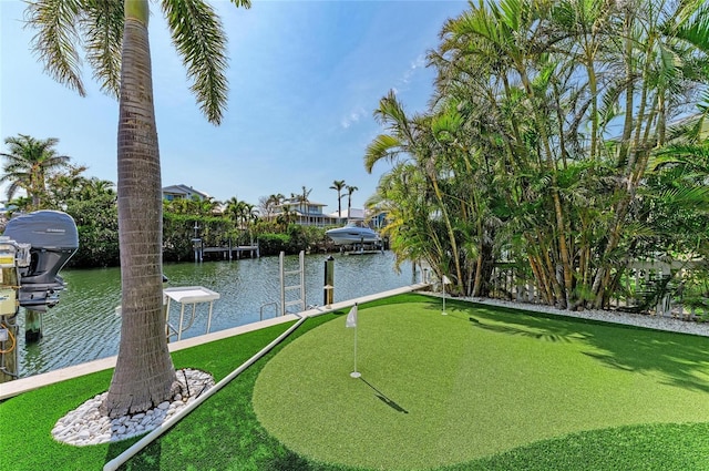 exterior space featuring a water view and a boat dock