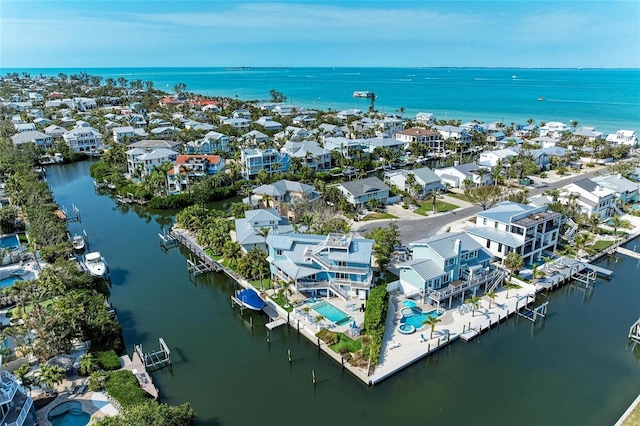 birds eye view of property with a residential view and a water view