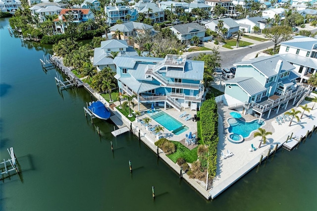 aerial view featuring a water view and a residential view