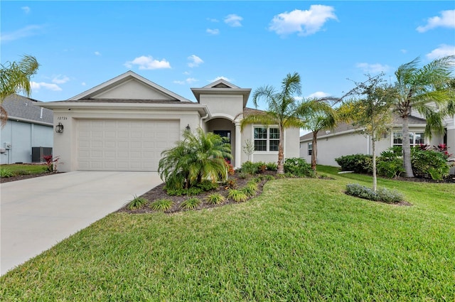 view of front of property with stucco siding, concrete driveway, a garage, cooling unit, and a front lawn