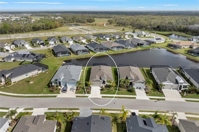 bird's eye view featuring a residential view and a water view