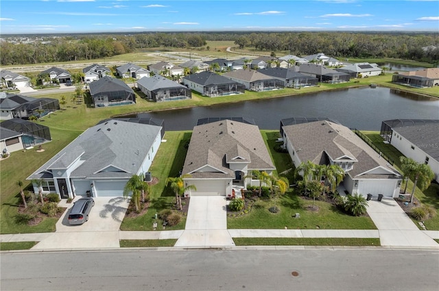 birds eye view of property with a residential view and a water view