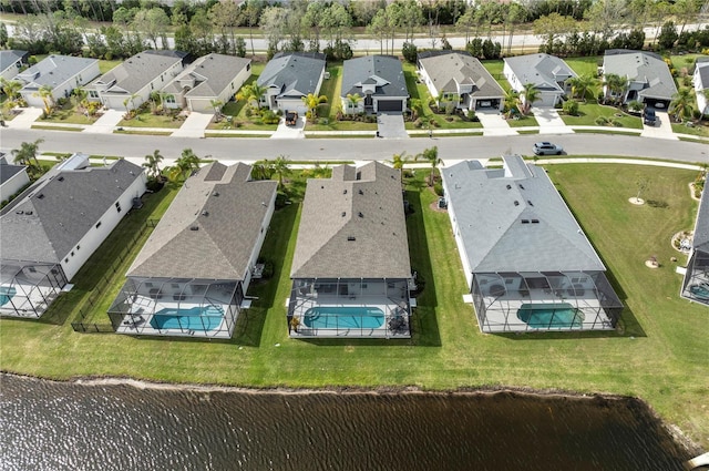 bird's eye view with a water view and a residential view