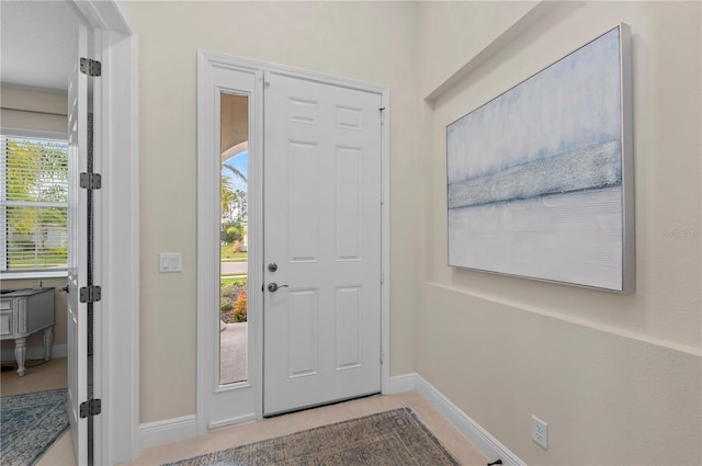 entryway featuring baseboards