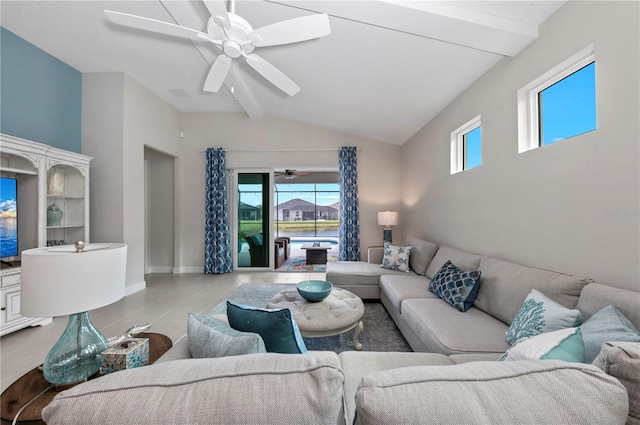 living area featuring ceiling fan, lofted ceiling with beams, tile patterned flooring, visible vents, and baseboards